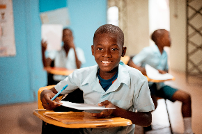 boy holding white paper